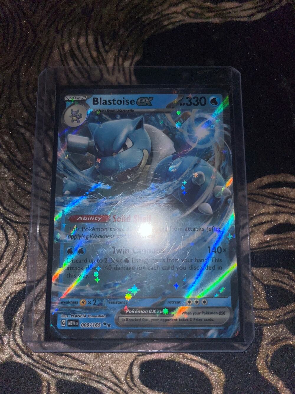 Blastoise ex card,  card number 009/165 from Scarlet & Violet—151 set.
